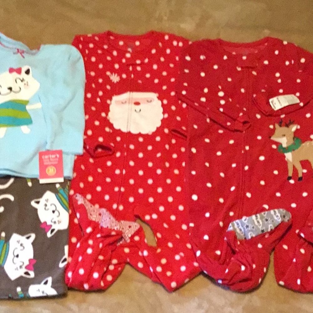 Carters size 3T pajamas, 2 NWT. Santa pair great condition